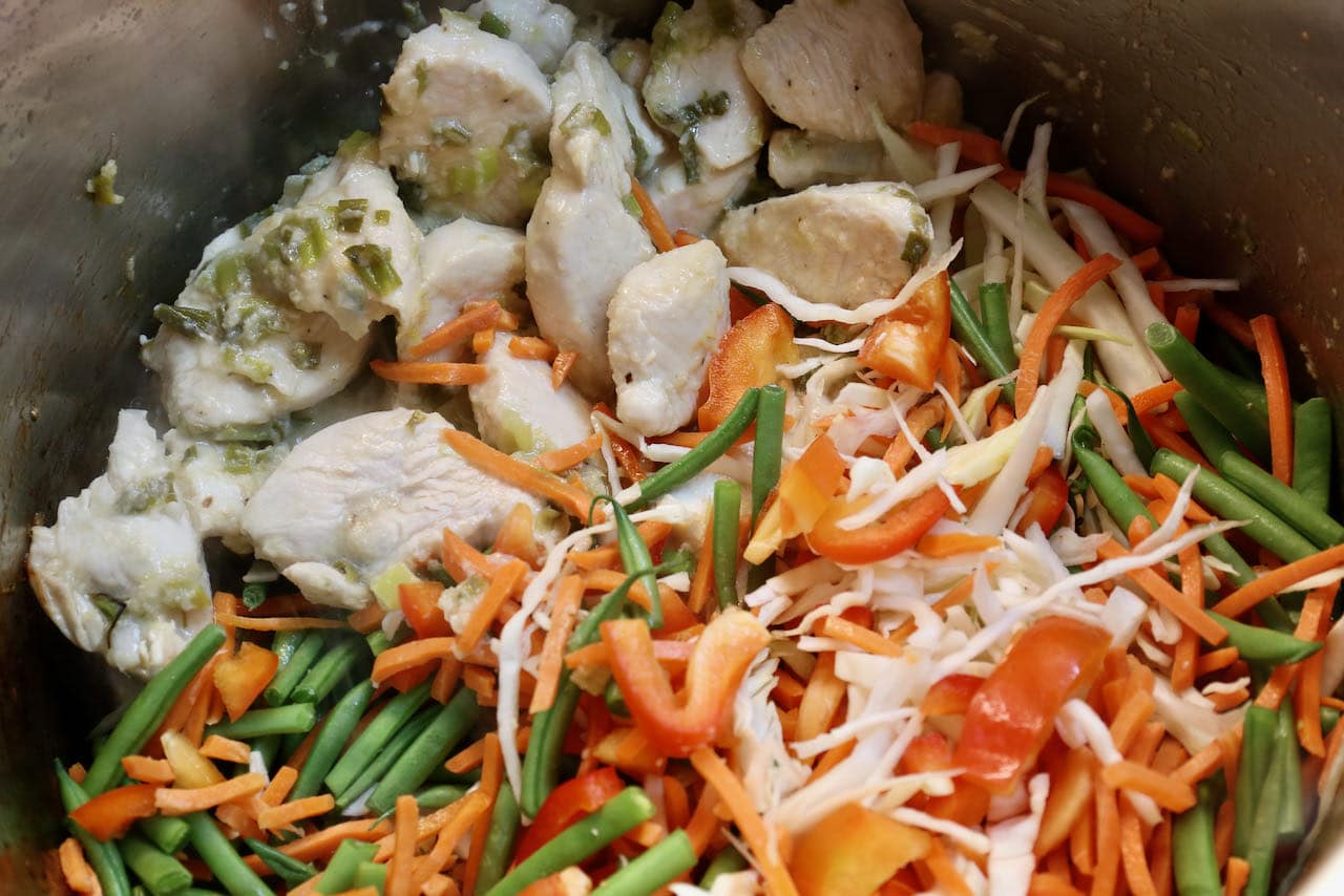 Add sliced cabbage, green beans and bell peppers to the Chicken Manchow Soup.