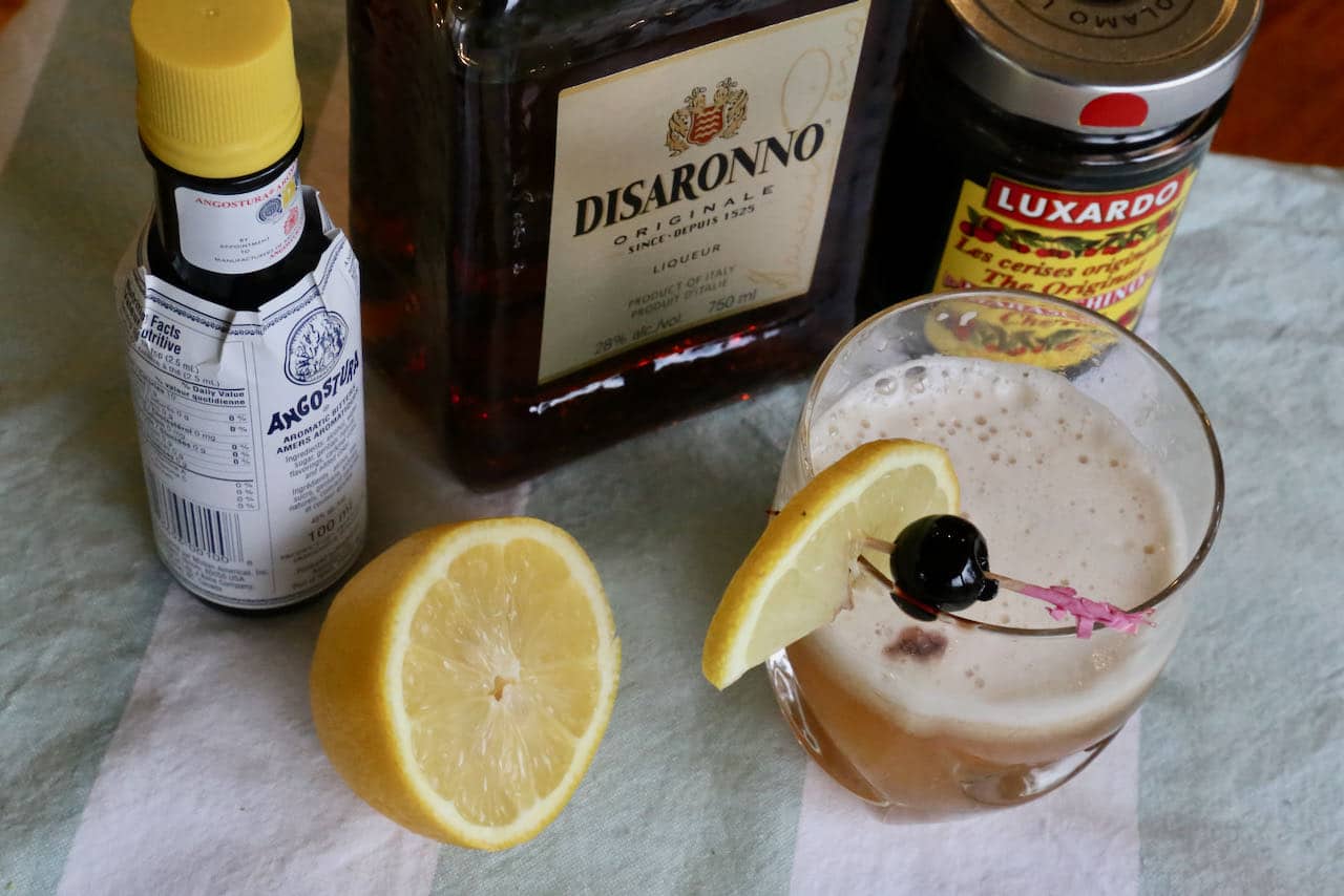 Garnish a classic Disaronno Sour with a lemon slice and Maraschino cherry.