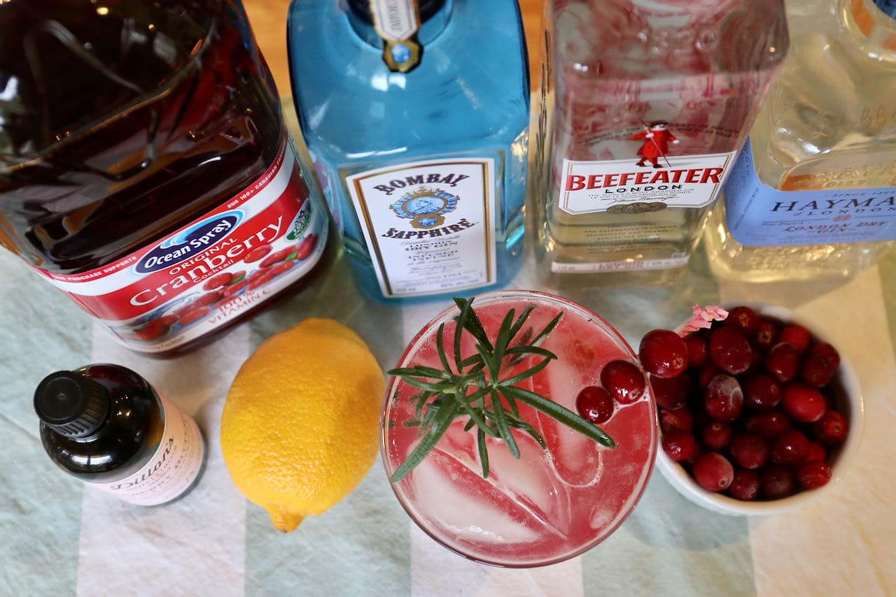 Our Gin and Cranberry Cocktail recipe is garnished with fresh cranberries and rosemary sprig.