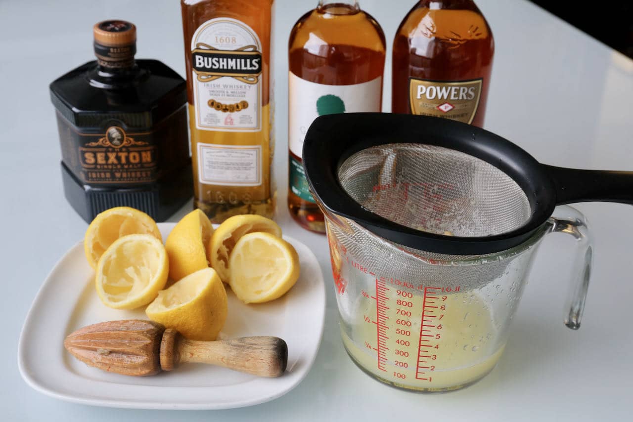 Pass freshly squeezed lemon juice through a sieve to make the best Irish Whiskey Sour cocktail.