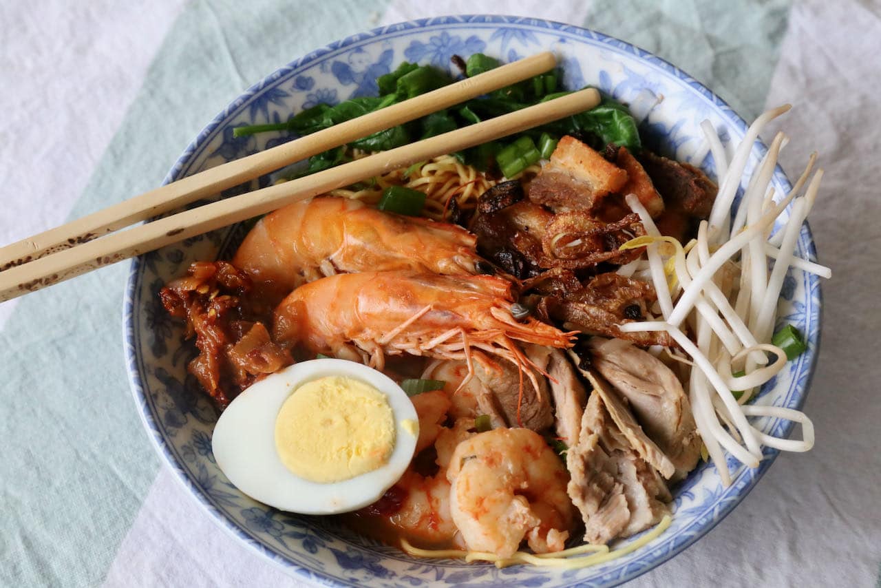 Serve our Hokkien Mee recipe with fried shallots, bean sprouts, scallions, chili paste and hard boiled eggs.