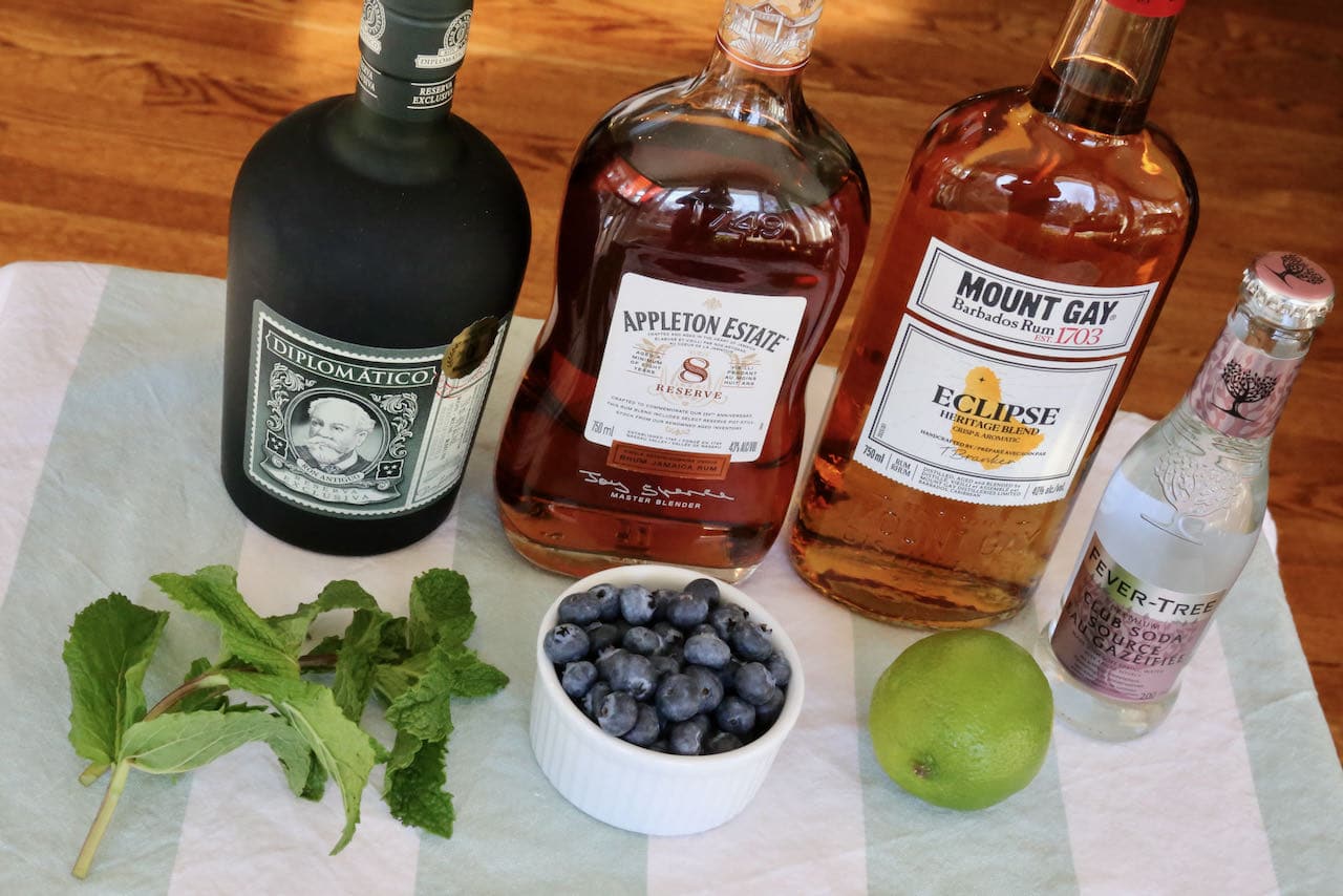 Blue Mojito ingredients include fresh blueberries, lime, mint and soda.