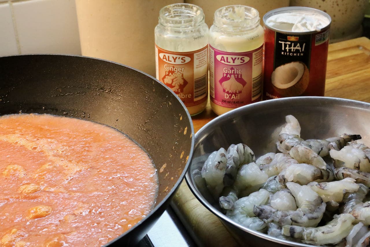 Cook prawns in Chingri Malai Curry sauce with garlic, ginger and coconut milk.