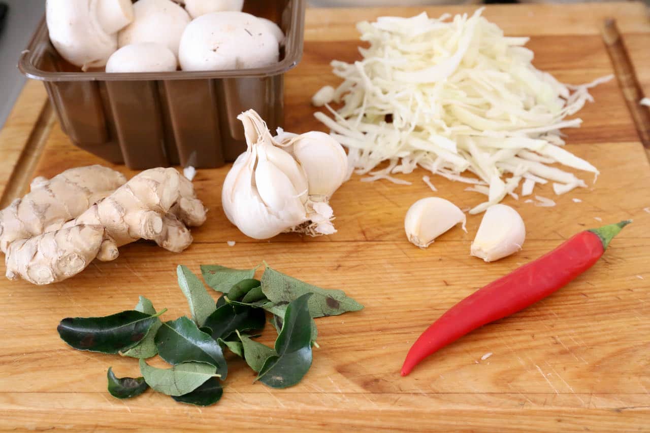Our homemade healthy Paneer Soup features garlic, cabbage, mushrooms, ginger, curry leaf and chili.