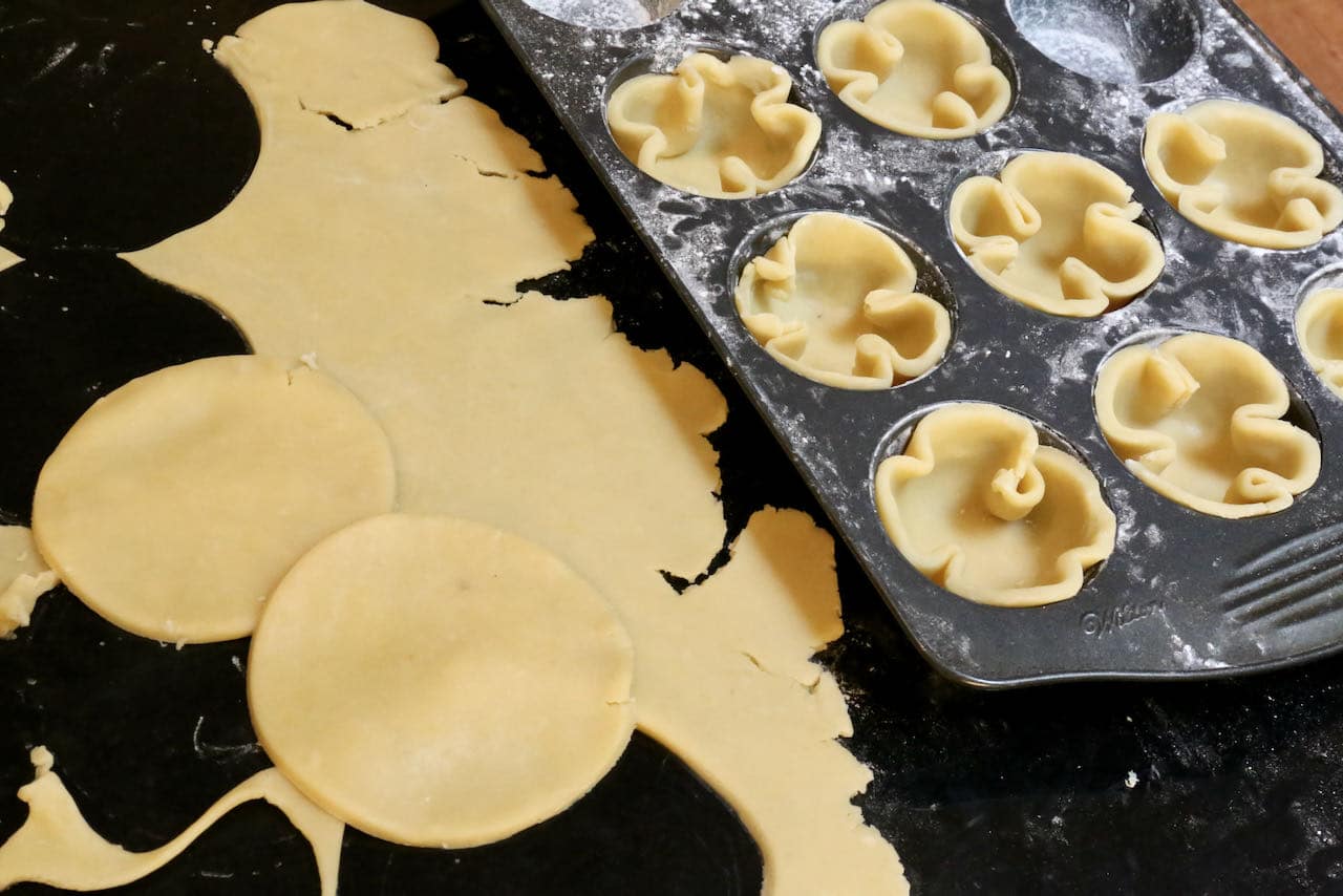 Line muffin tins with pastry circles to act as the crust for your Pistachio Tartlets. 