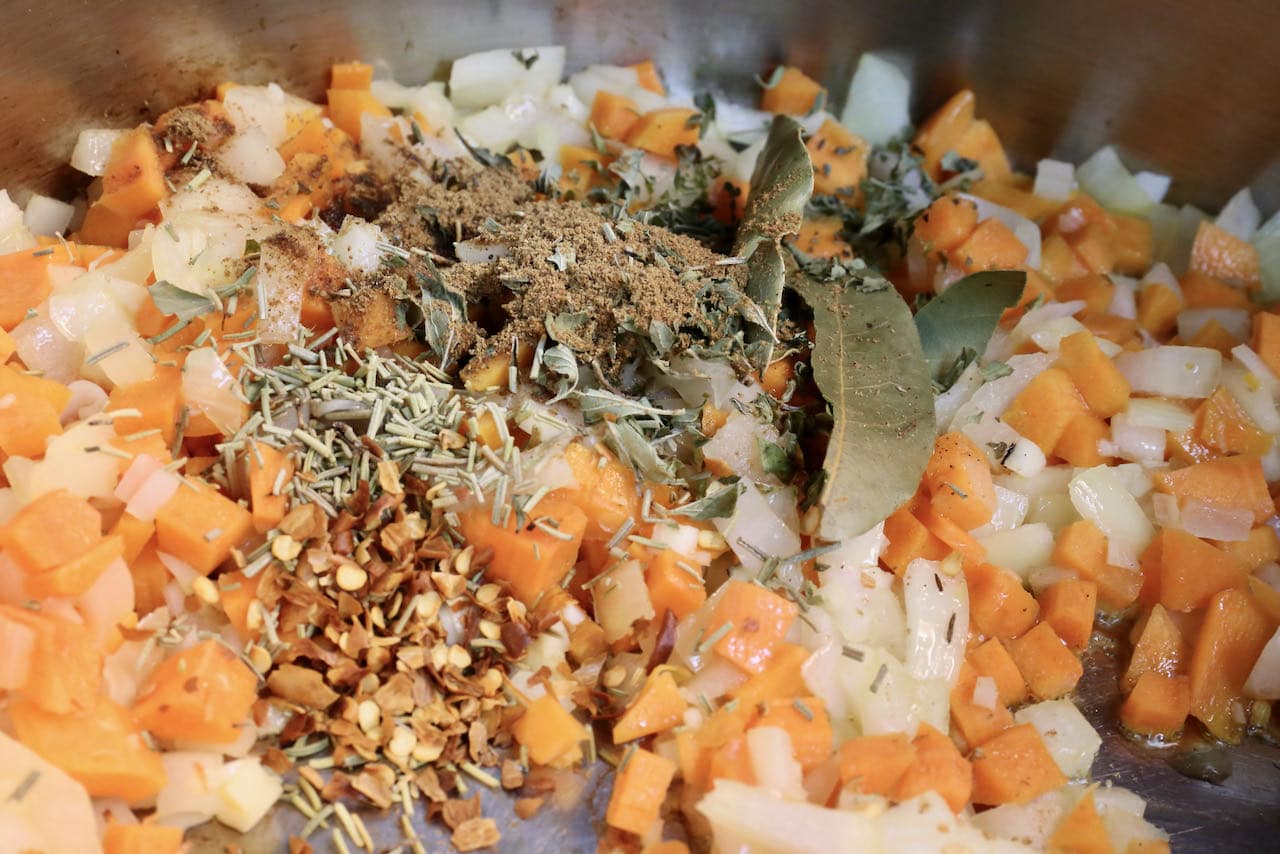 Saute vegetables in oil then add spices in a large pot. 