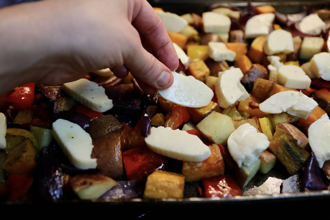 Place slices of Halloumi cheese over the vegetables and bake in the oven on a tray.