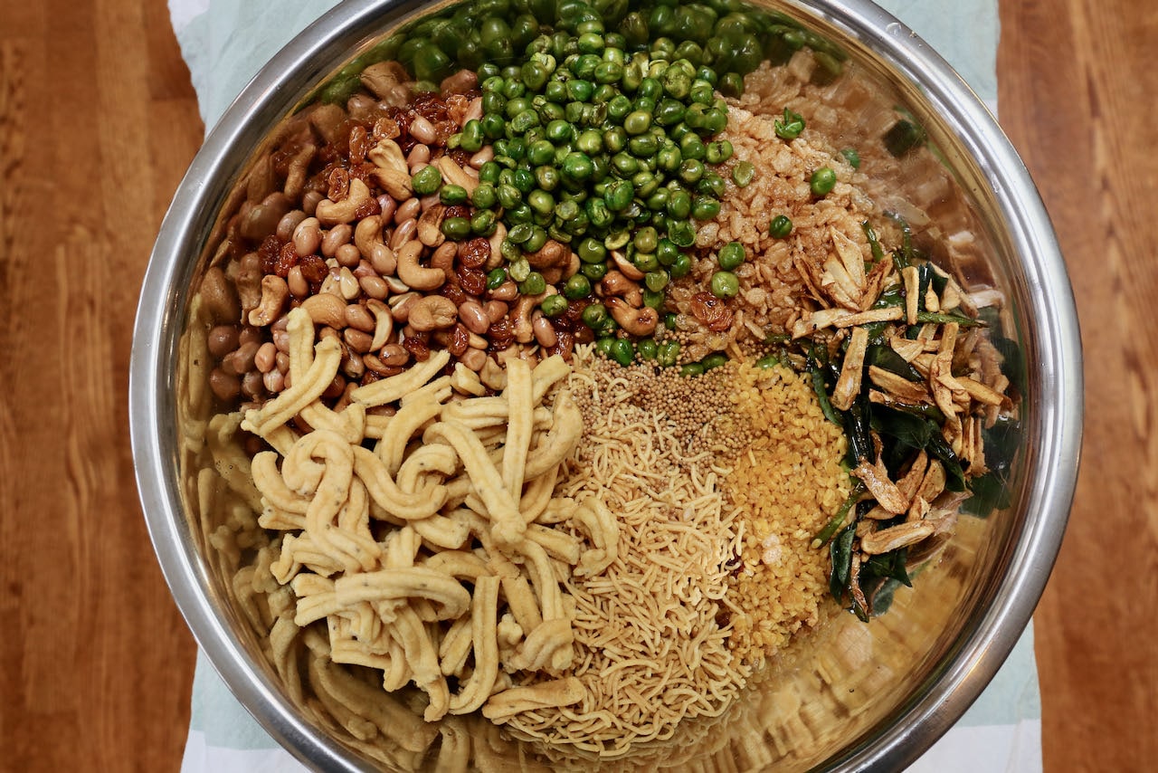 Let Chivda Chanachur Bombay Mixture Namkeen recipe ingredients cool in a large bowl before mixing.