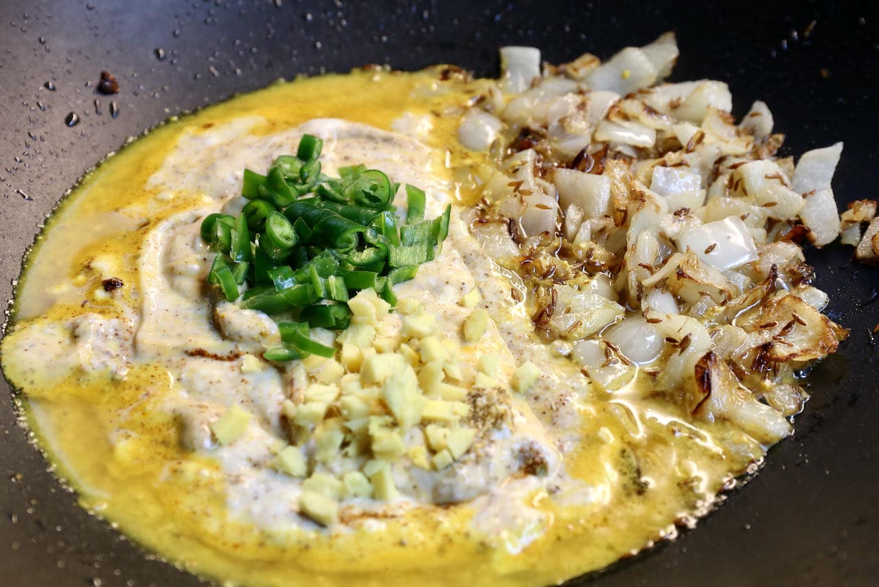 Prepare Pitod Ki Sabji sauce in a large wok or skillet.