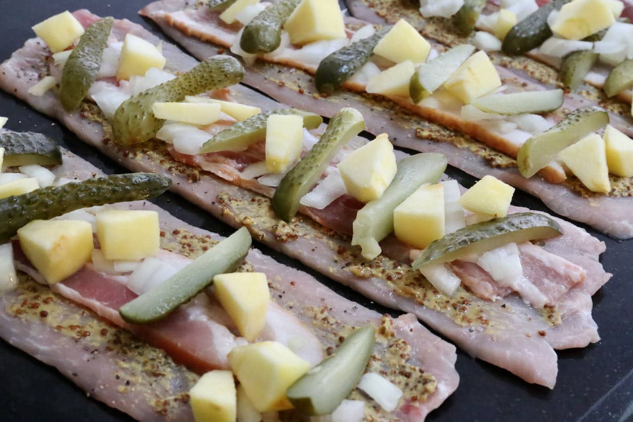 Roll Pork Rouladen tightly to ensure filling does not fall out of each roll.