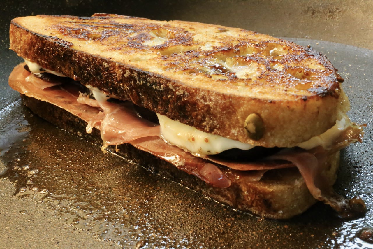 Cook the Prosciutto Grilled Cheese on a hot skillet or griddle until golden brown.