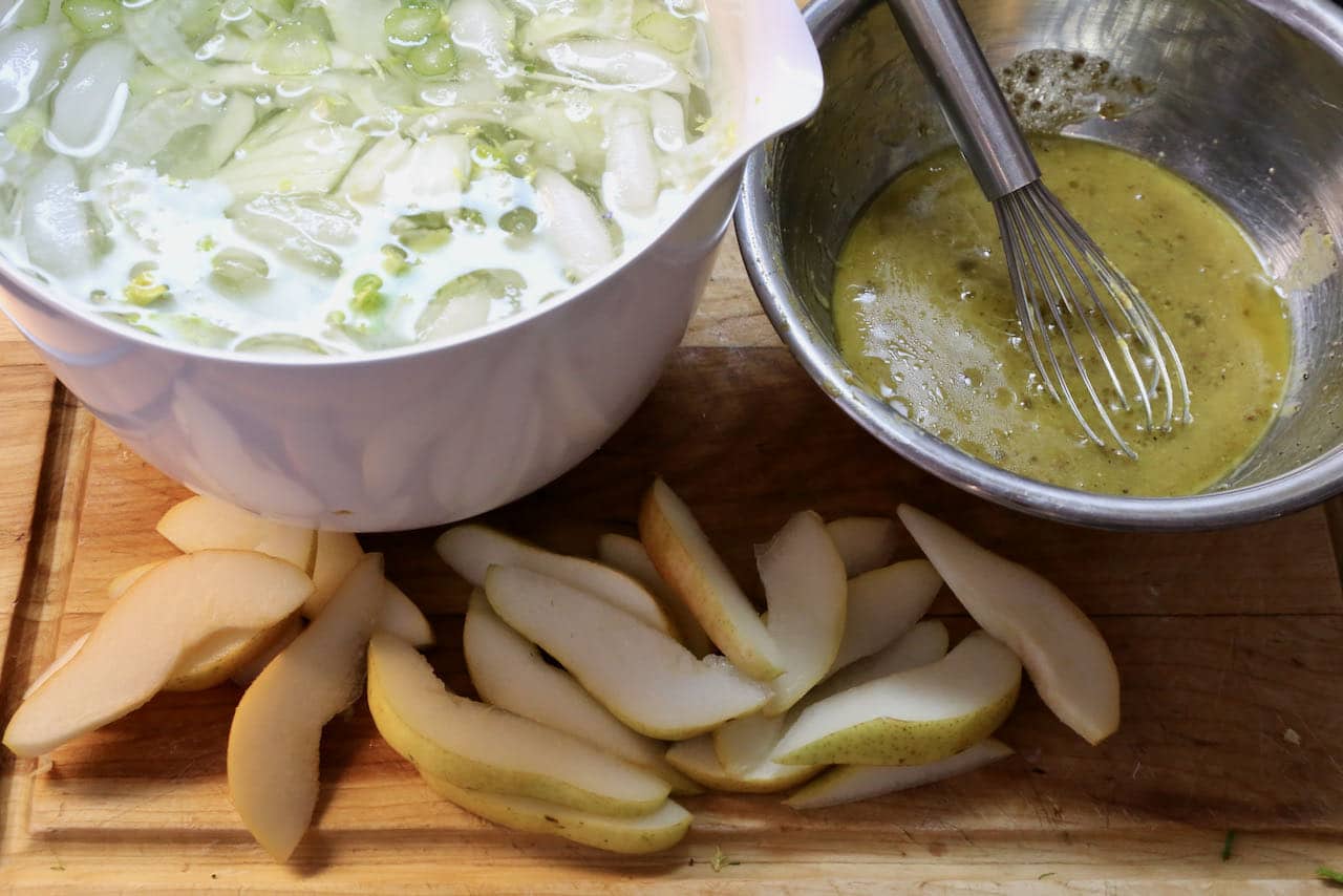Rocket Pear Salad features thinly sliced fennel and mustard lemon vinaigrette dressing.