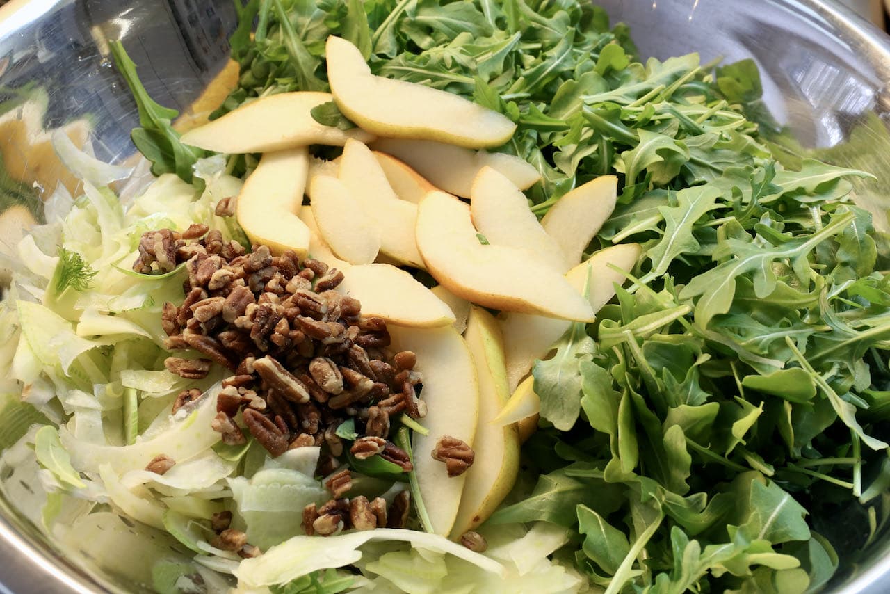 Toss Pear and Rocket Salad with chopped roasted pecans.