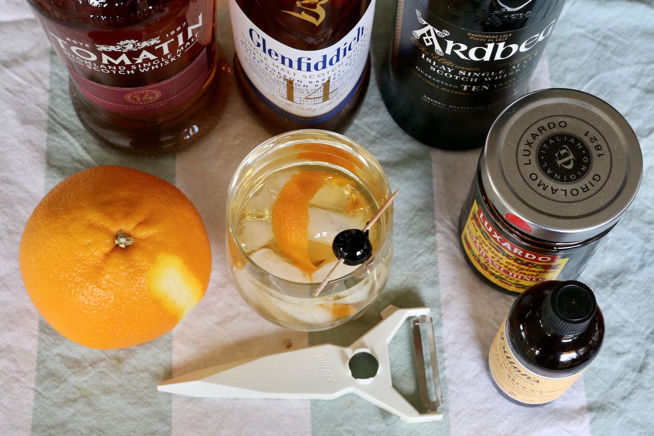 The classic Scotch Old Fashioned features bitters, white sugar, orange peel, Scottish whisky and a cherries.