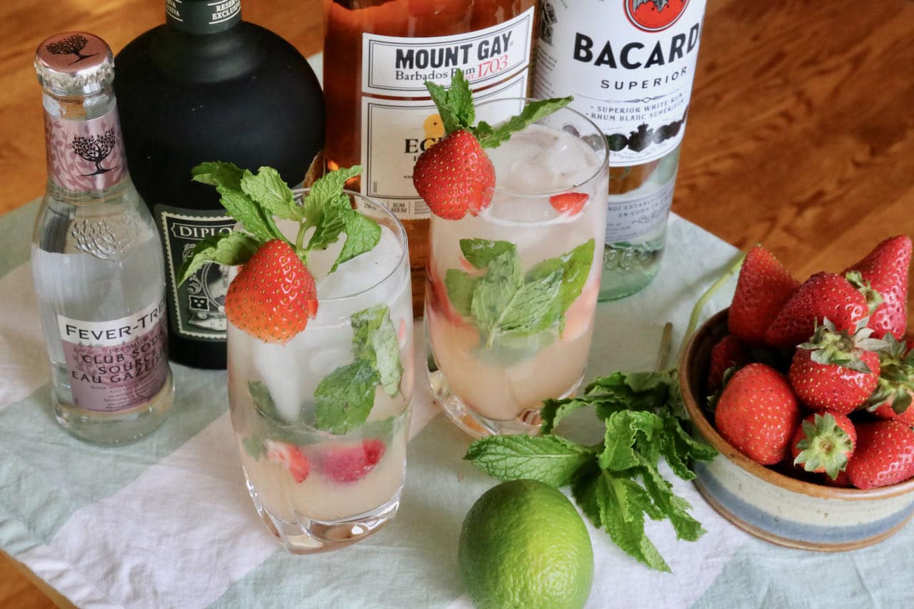Our easy Strawberry Mojito recipe is garnished with fresh mint and strawberry slice.