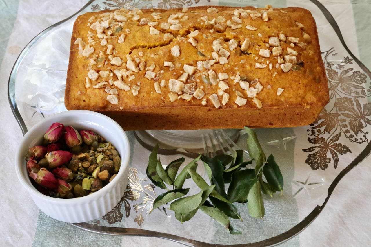 Indian Cake garnish ideas: curry leaf, dried rose buds and chopped pistachio.