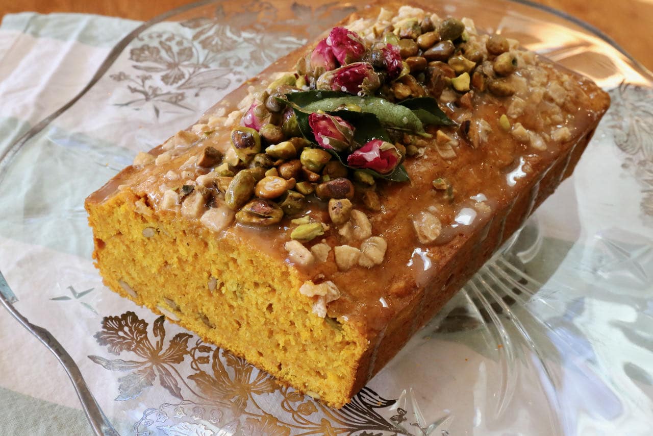 Slice open our Indian Turmeric Tea Cake and you'll find a bright yellow crumb interior dotted with pumpkin seeds.