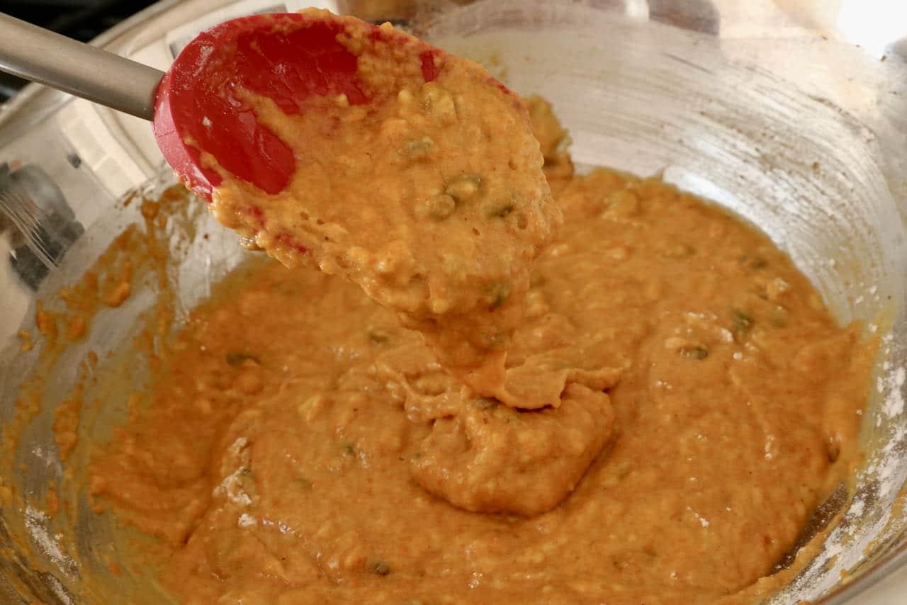 Pumpkin seeds should be gently folded into Spiced Indian Cake batter.