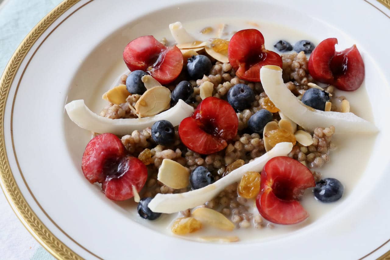 Serve gluten free porridge with berries and stone fruit in the summer.