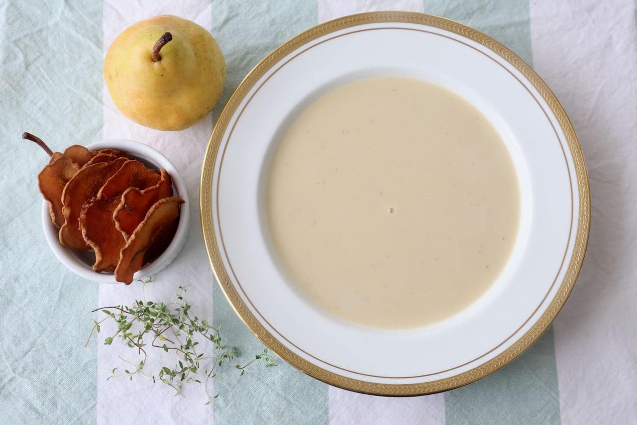 Serve Parsnip and Pear Soup in a large bowl and garnish with pear crackers and fresh thyme.