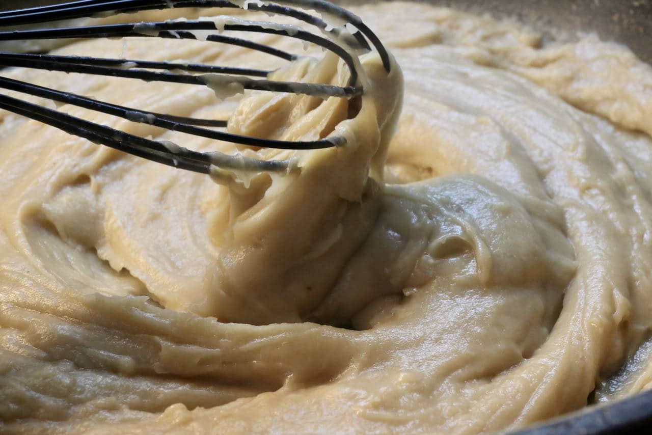 Begin preparing our Bitterballen recipe by creating a creamy roux over the stove.