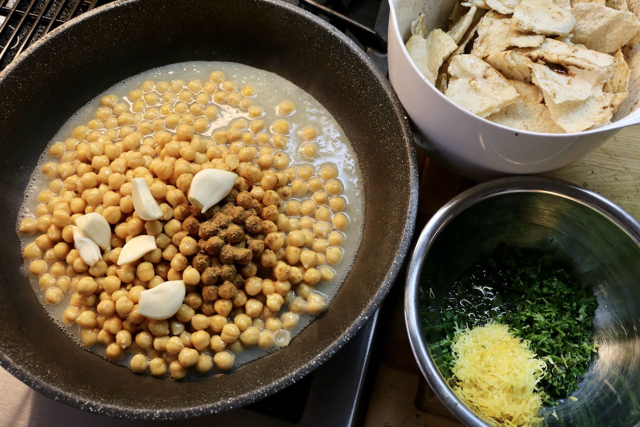 Eggplant Fatteh Components: spiced chickpeas, torn pita, parsley and lemon.