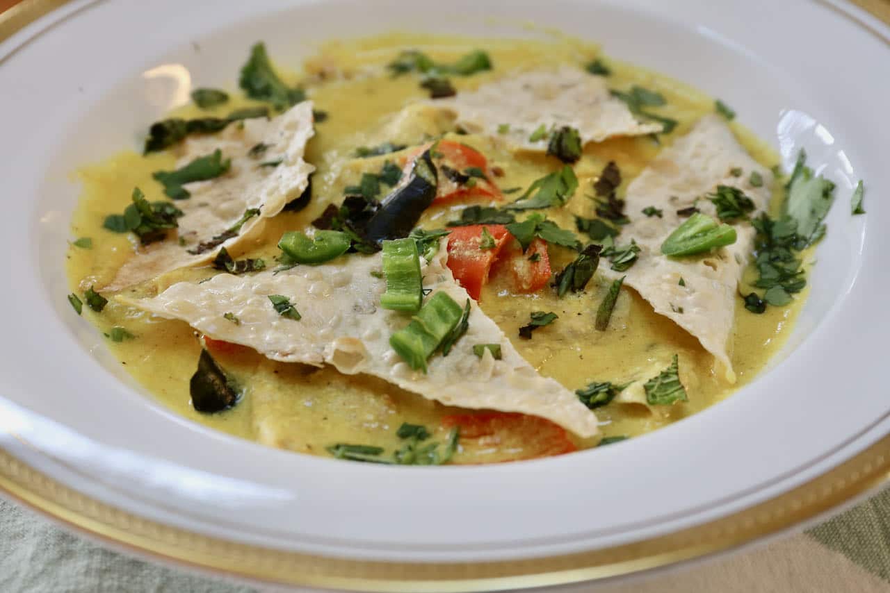 Our Papad Ki Subji recipe is garnished with fresh herbs and spicy chili.