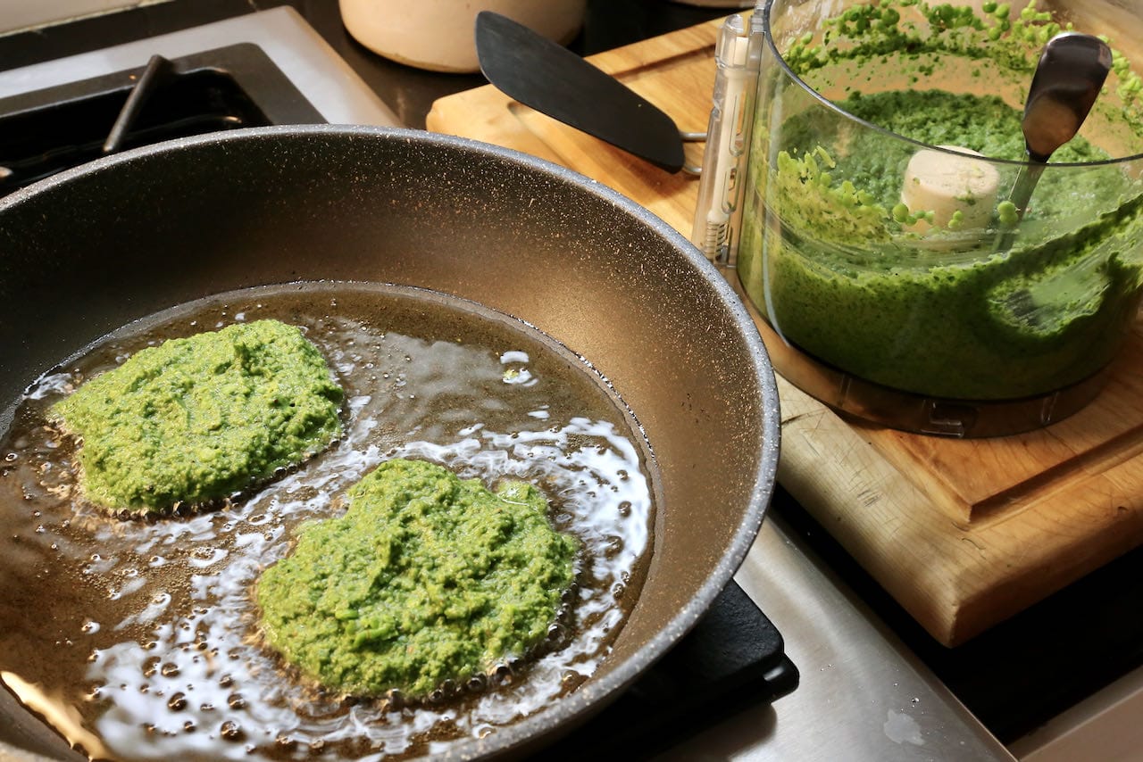Fry Pea Fritters in a nonstick skillet in vegetable oil until browned and crispy on both sides.