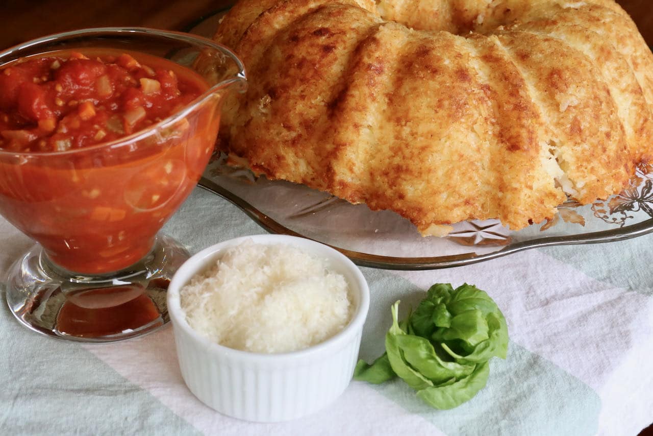 Once finished baking, invert the Sartu Di Riso bundt pan to find a browned and crispy exterior.