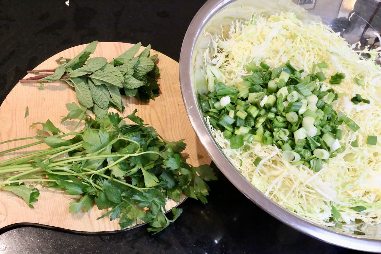 Malfouf Salad features thinly sliced cabbage, scallions, parsley and fresh mint. 