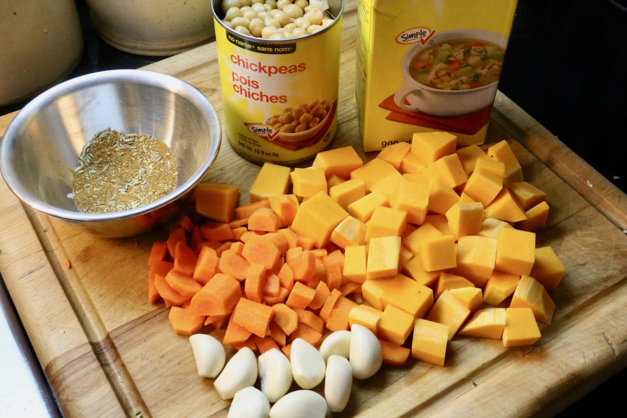 Prepare spice mix and chop carrots and squash.