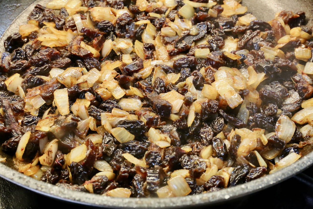 Cook raisins and dates until softened in a nonstick skillet.