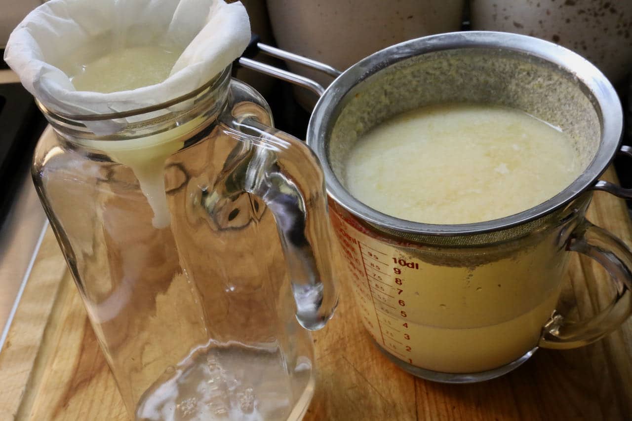 Clarified Milk Punch is first strained in a fine sieve then passed through a coffee filter.