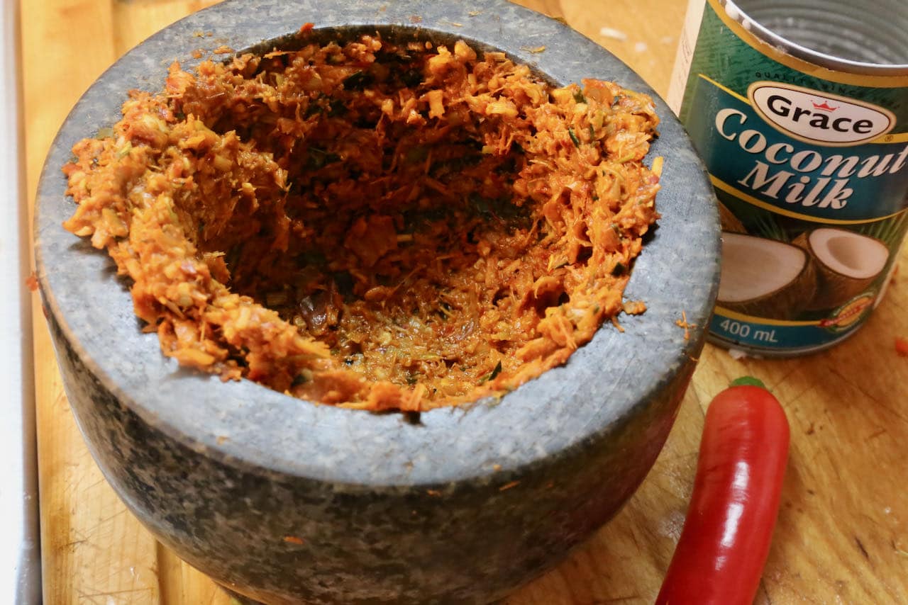 Homemade Panang Curry Paste is prepared in a mortar and pestle. 