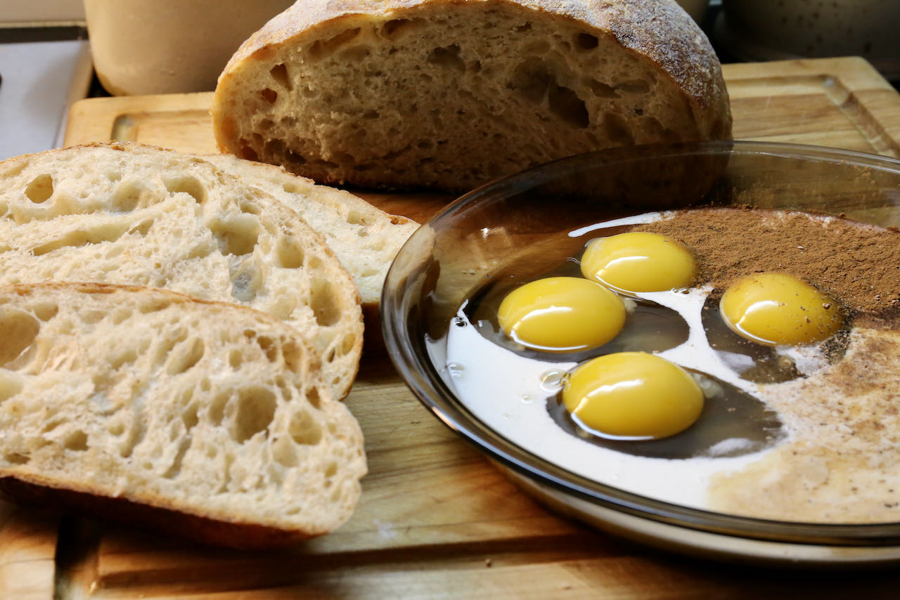 Soak thick slices of sourdough bread into a shallow dish filled with eggs, cream, milk and spices.