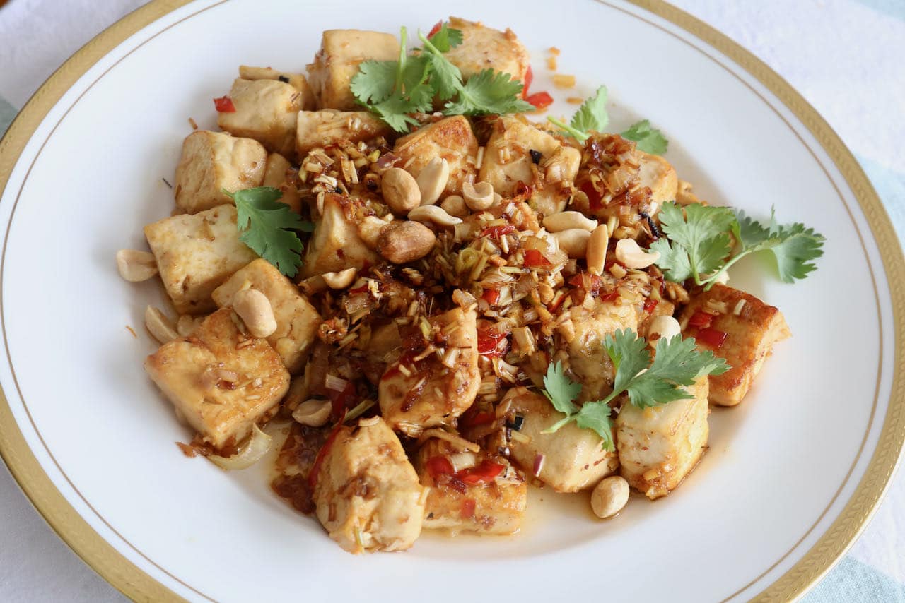 Serve Lemongrass Tofu garnished with peanuts and cilantro.