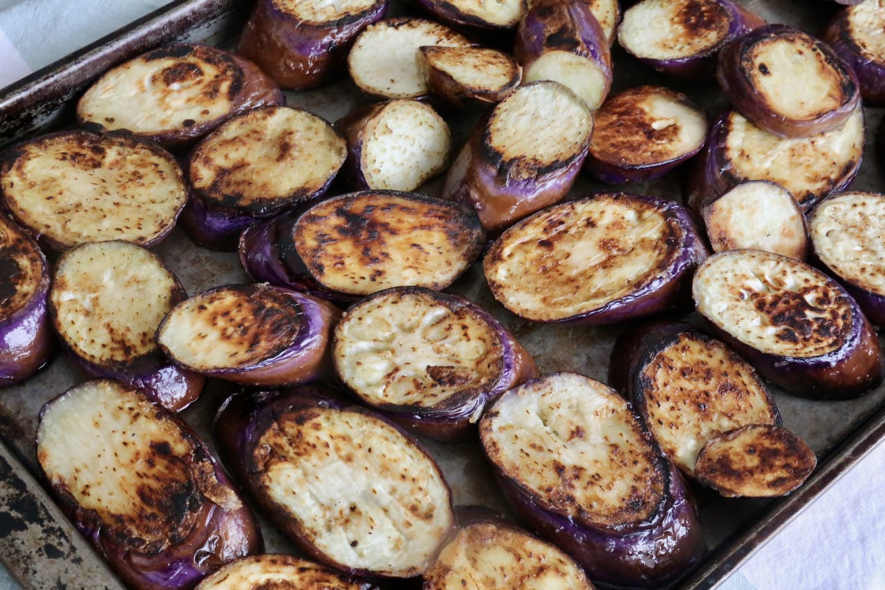 Cook eggplant slices until browned and crispy.