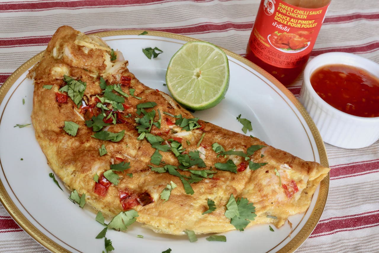 Serve Thai Prawn Omelette with fresh lime, chopped cilantro and Sweet Chili Sauce.