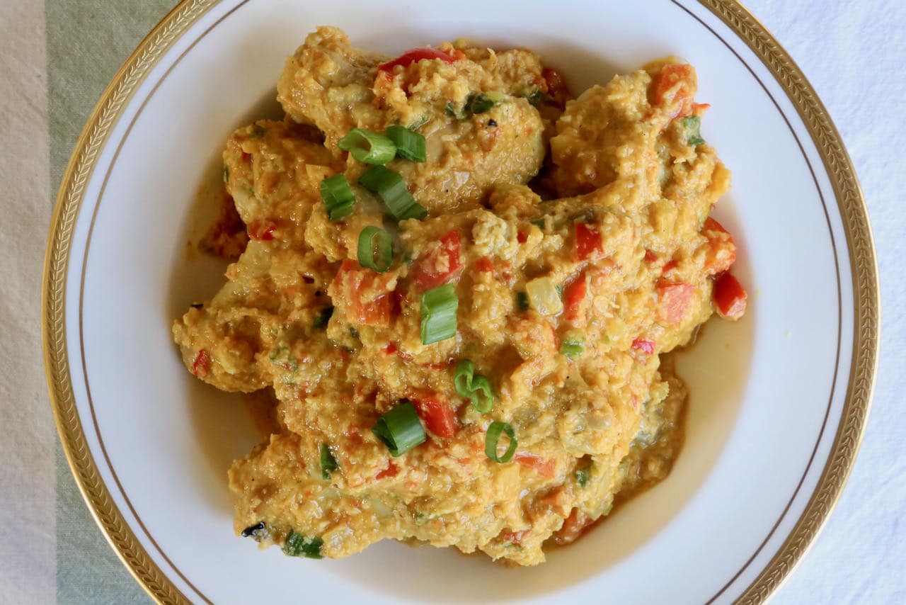 Serve Chicken Wing Stew topped with chopped scallions and steamed rice.