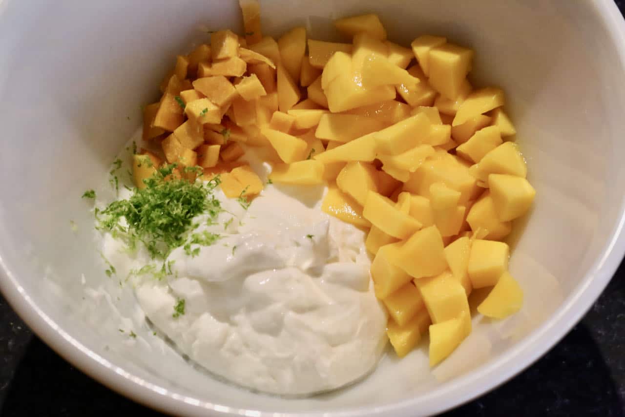 Gluten Free Chickpea Flour Pancakes are served with a creamy mango, yogurt and lime topping.