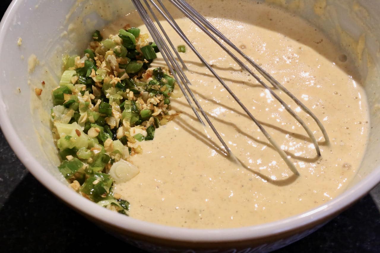 Savoury Indian Chickpea Flour Pancake batter is flavoured with curry leaf, ginger, garlic, chile, scallions and masala.