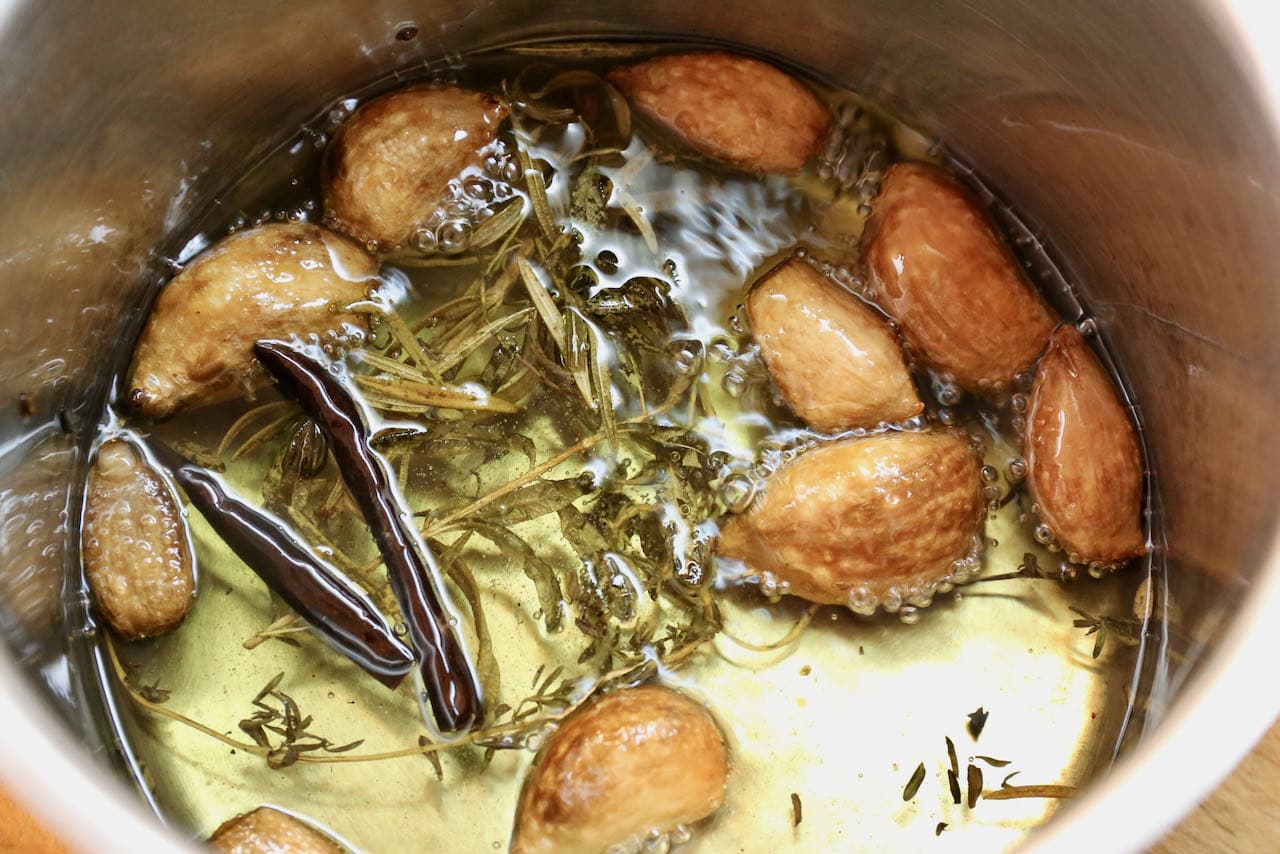 In a small pot prepare the dips topping featuring hot oil, herbs, dried peppers and garlic. 