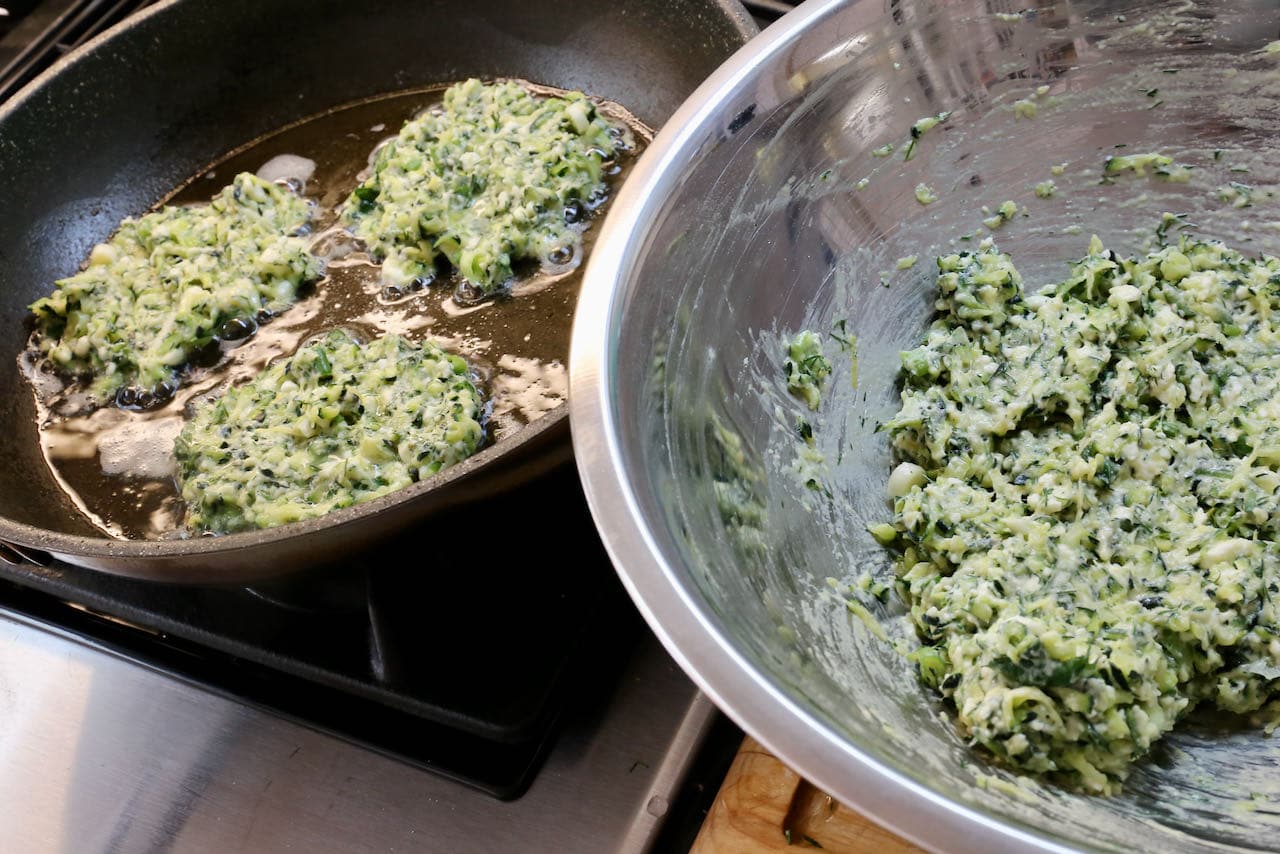 In a nonstick skillet fry vegetarian Mucver Tarif Zucchini Fritters. 