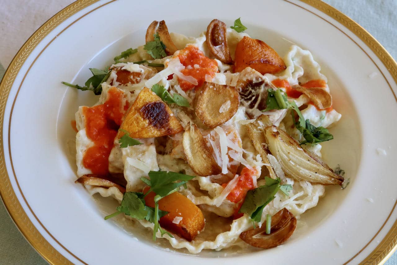 Creamy Mafalda Pasta yogurt sauce is contrasted with crunchy garlic chips and spicy chili sauce.