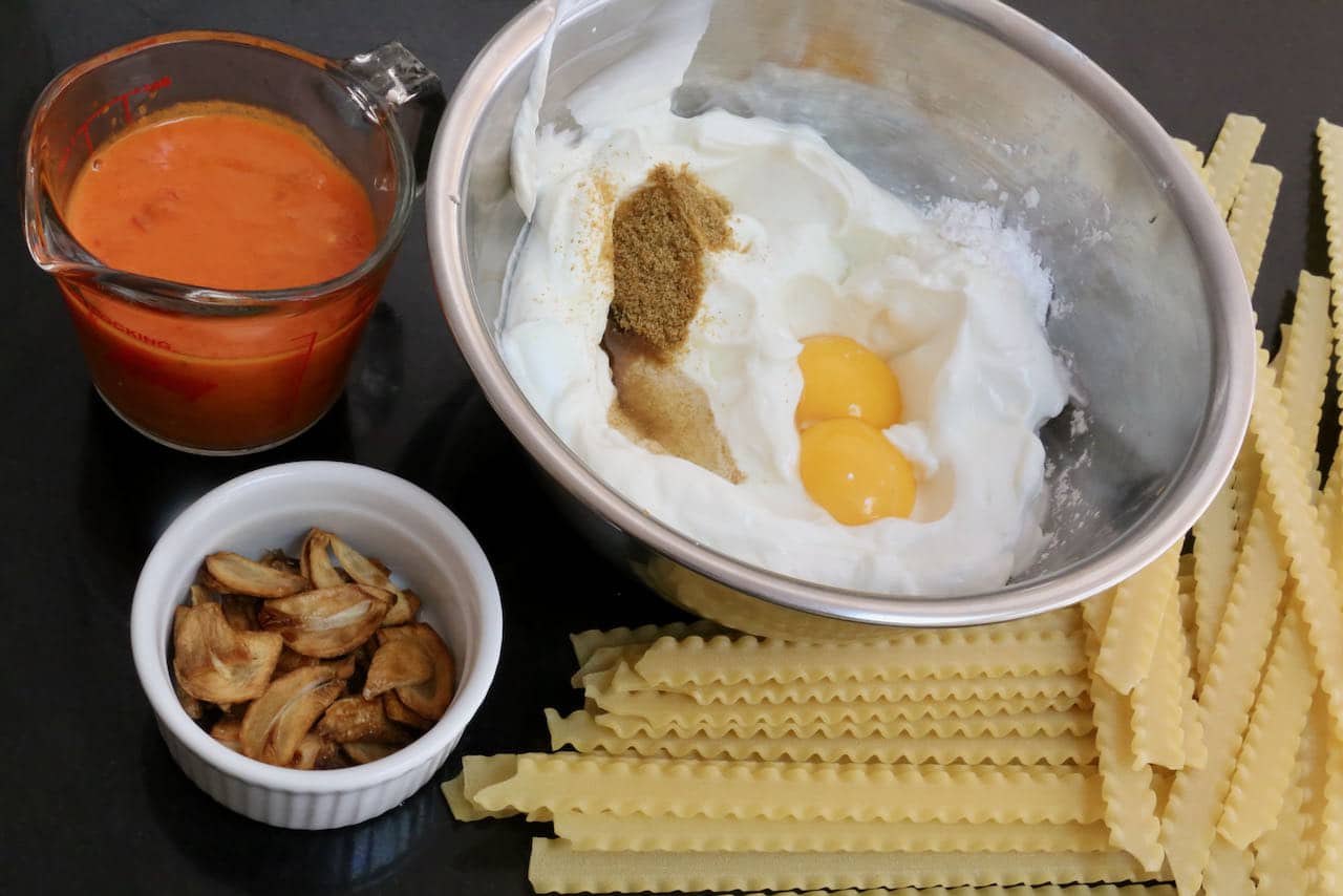 Our easy Mafalda Pasta recipe features dried noodles, yogurt sauce, garlic chips and spicy chili sauce.