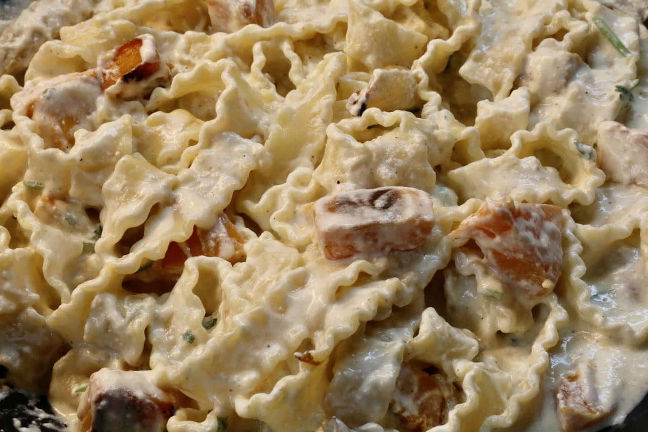 Toss al dente Mafalda Pasta Noodles in creamy yogurt sauce with roasted squash.