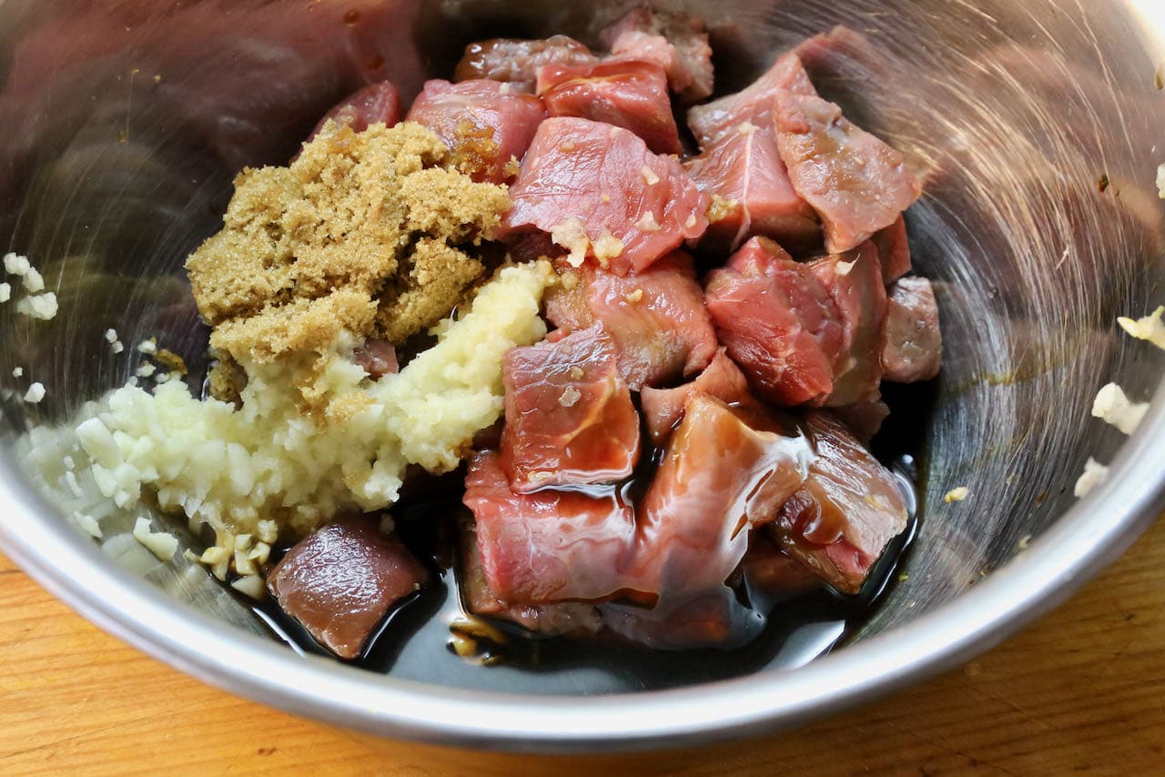 Combine Bo Luc Lac ingredients in a mixing bowl and allow beef to marinate. 