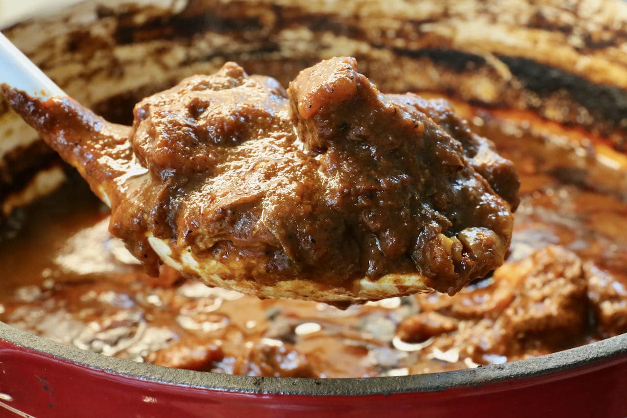 Cook Asado de Boda in a Dutch Oven until the pork is tender. 