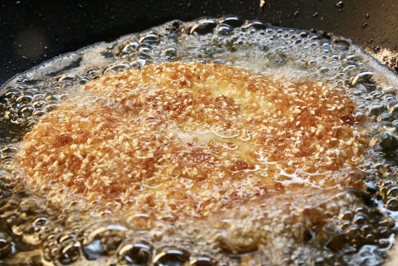 Shallow fry Chicken Schnitzel in canola oil until browned and crispy.