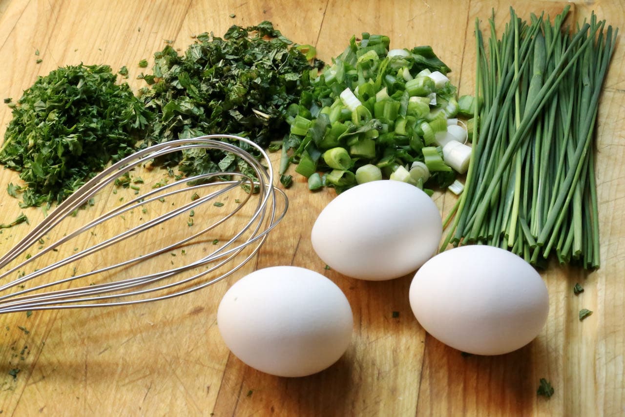 Our easy Ejjeh recipe features chopped parsley, mint, scallions, chives and fresh eggs.